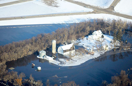 Waterworld: Vehicle parked in the floodwater surrounding a farm near Fargo, North Dakota, in March 2009