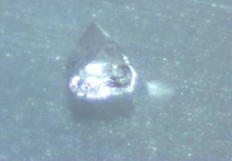 This crystal was an odd pyramid shape.  On the front right there were dark specks in the crystal.  200x