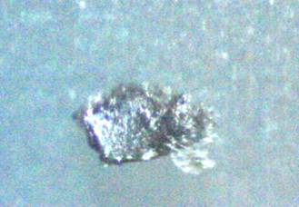 Metal fragment found in Morgellons lesions.  200x