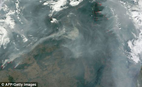 A satellite image from this afternoon shows smoke from wildfires burning in Russia. The red dots indicate active fires. Scientists believe the jetstream could be to blame